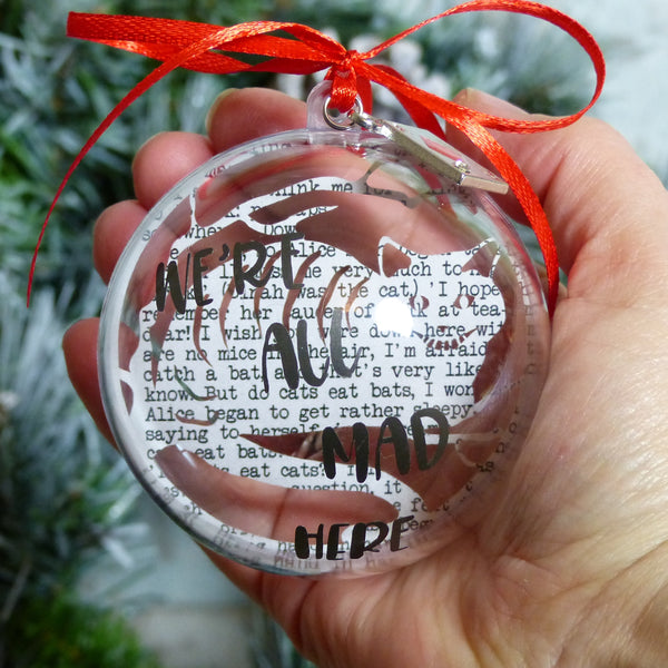 Cheshire cat paper cut front view vinyl text reads we're all mad here