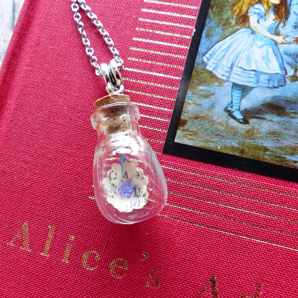 Alice in Wonderland daisy in bulb bottle necklace