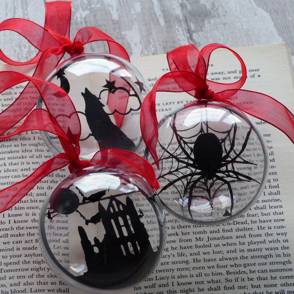Dracula bauble set paper cut silhouettes from Whitby Abbey, Howling wolf & spider