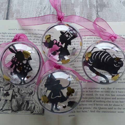 Quad of Alice in Wonder land paper cut silhouettes baubles The Cheshire Cat, Alice, The Mad Hatter & the White Rabbit